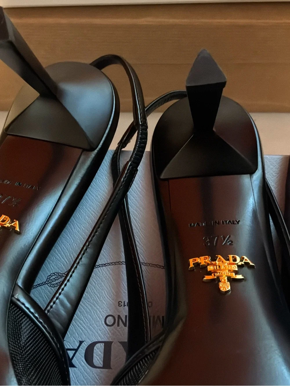Prada Black Pointed Slingback Pumps with Logo Plaque